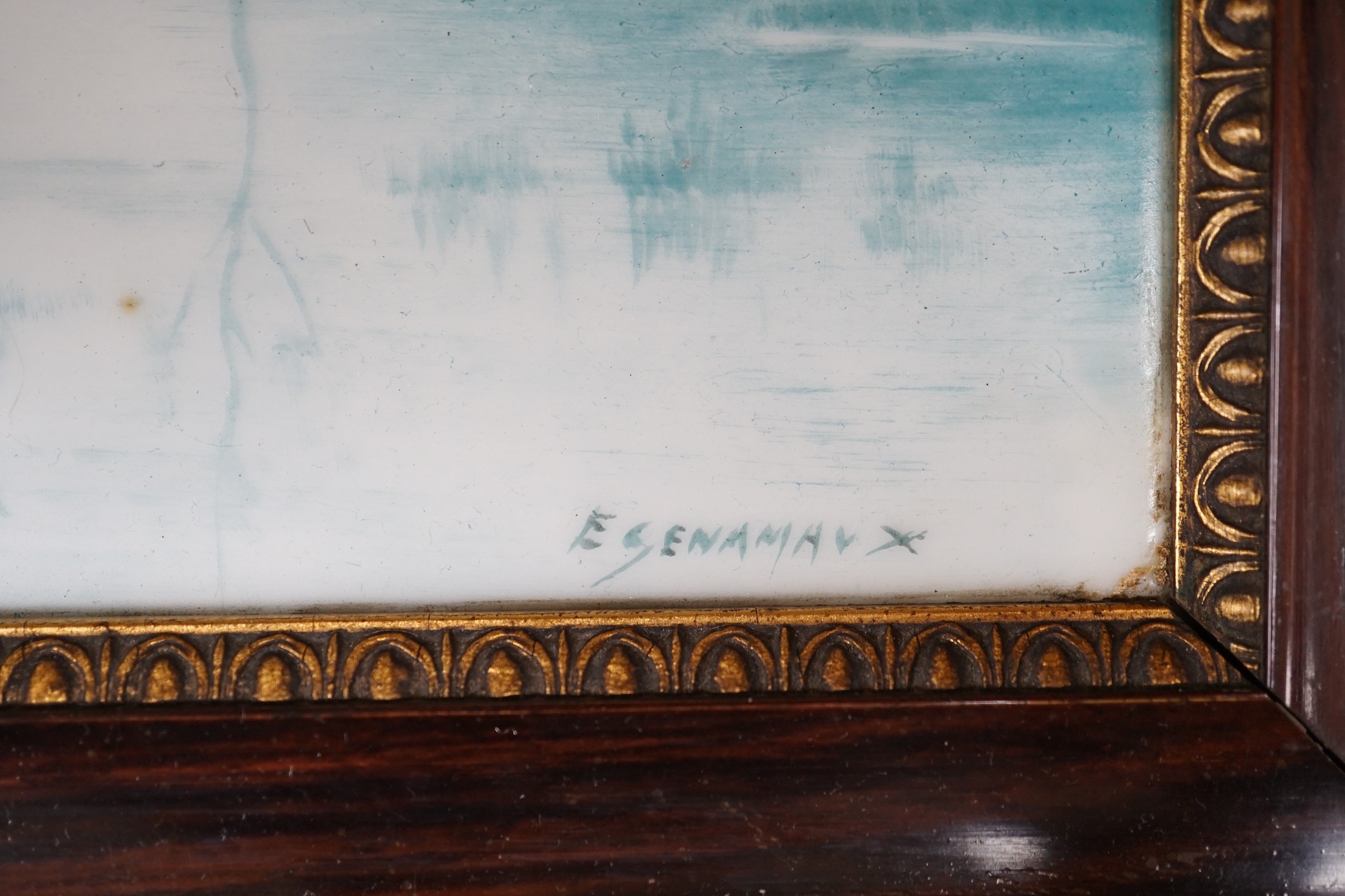 A French porcelain landscape plaque, indistinctly signed ‘E GENAMAN’